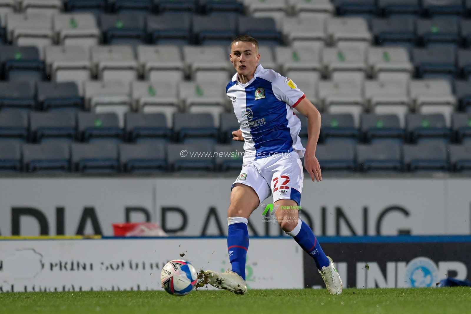 Taylor Harwood-Bellis #22 of Blackburn Rovers passes the ball