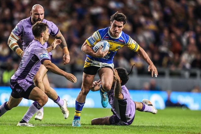 Brodie Croft of Leeds Rhinos is tackled by Tyrone May of Hull KR during the Betfred Super League round 23 match Leeds Rhinos vs Hull KR at Headingley Stadium, Leeds, United Kingdom, 21st August 2025

(Photo by Alfie Cosgrove/News Images)