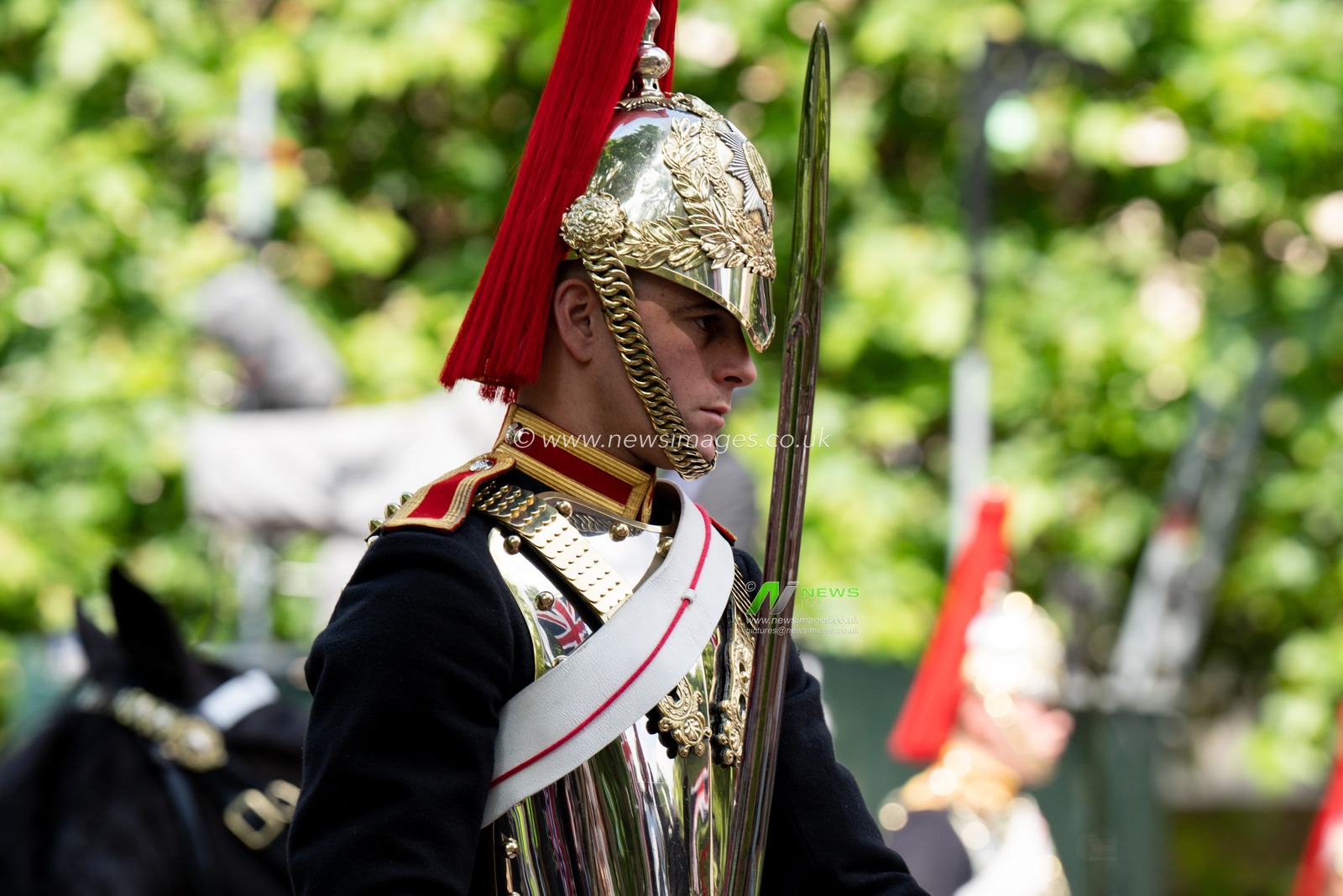 Solders take part in the parade down the mall before and after Trooping the Colour at Horse Guards Parade