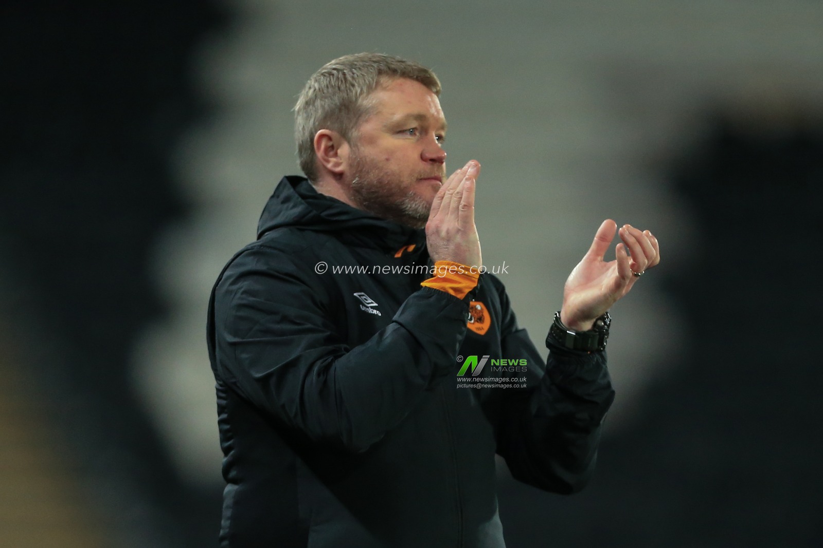Grant McCann manager of Hull City applauds his players after going 3-0 up