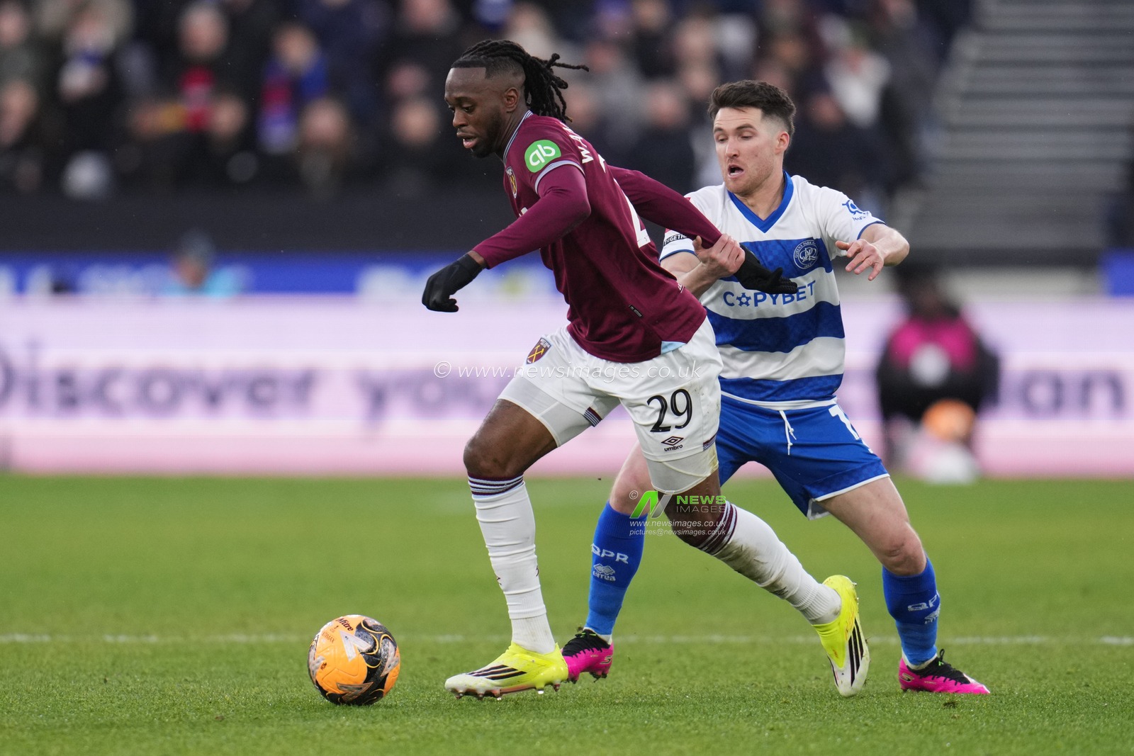 Aaron Wan-Bissaka of West Ham United on the ball under pressure during the Emirates FA Cup Third Round match West Ham United vs Queens Park Rangers at London Stadium, London, United Kingdom, 11th January 2026

(Photo by Harvey Murphy/News Images)