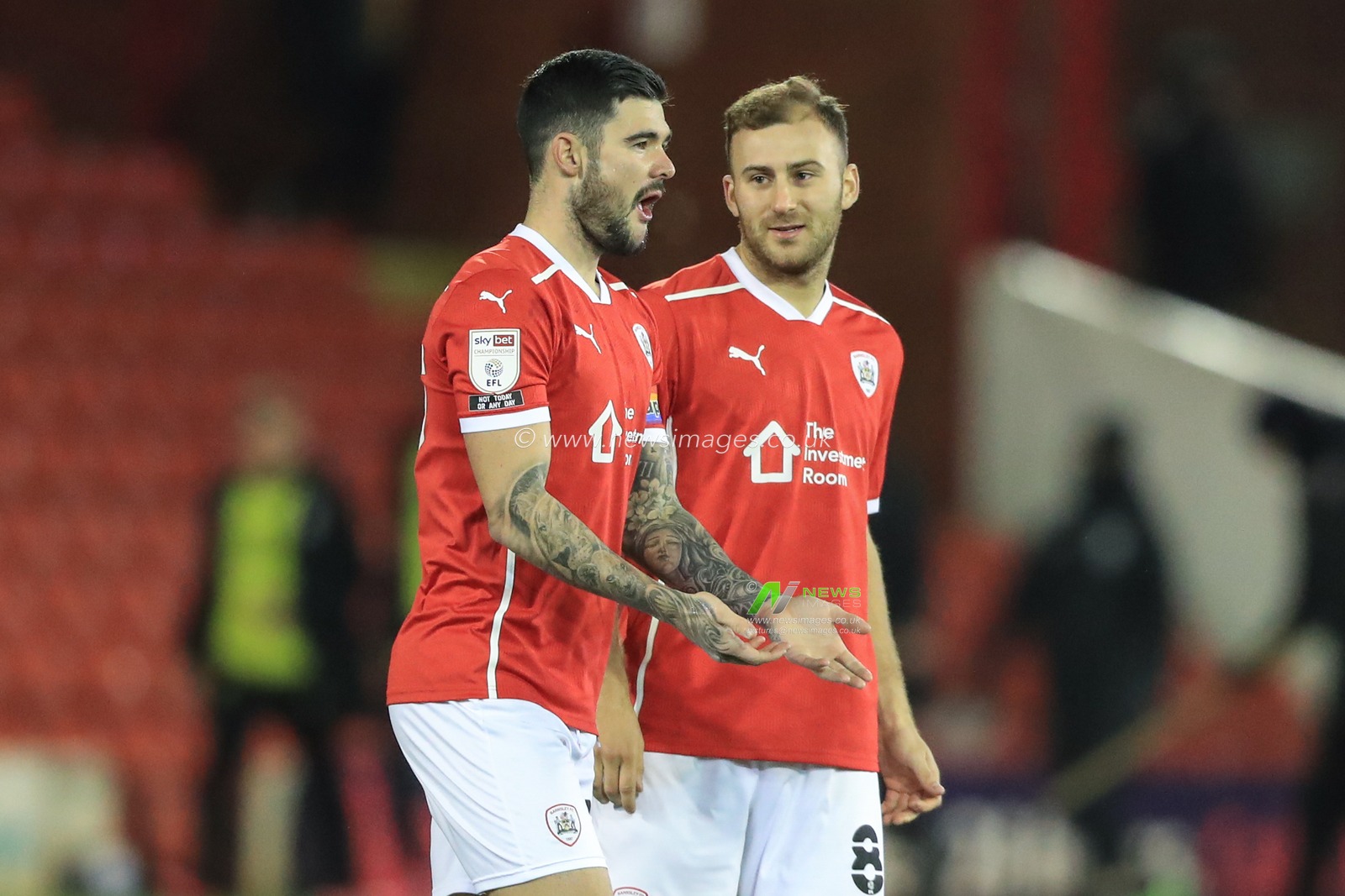 Alex Mowatt #27 of Barnsley talks to Herbie Kane #8 of Barnsley