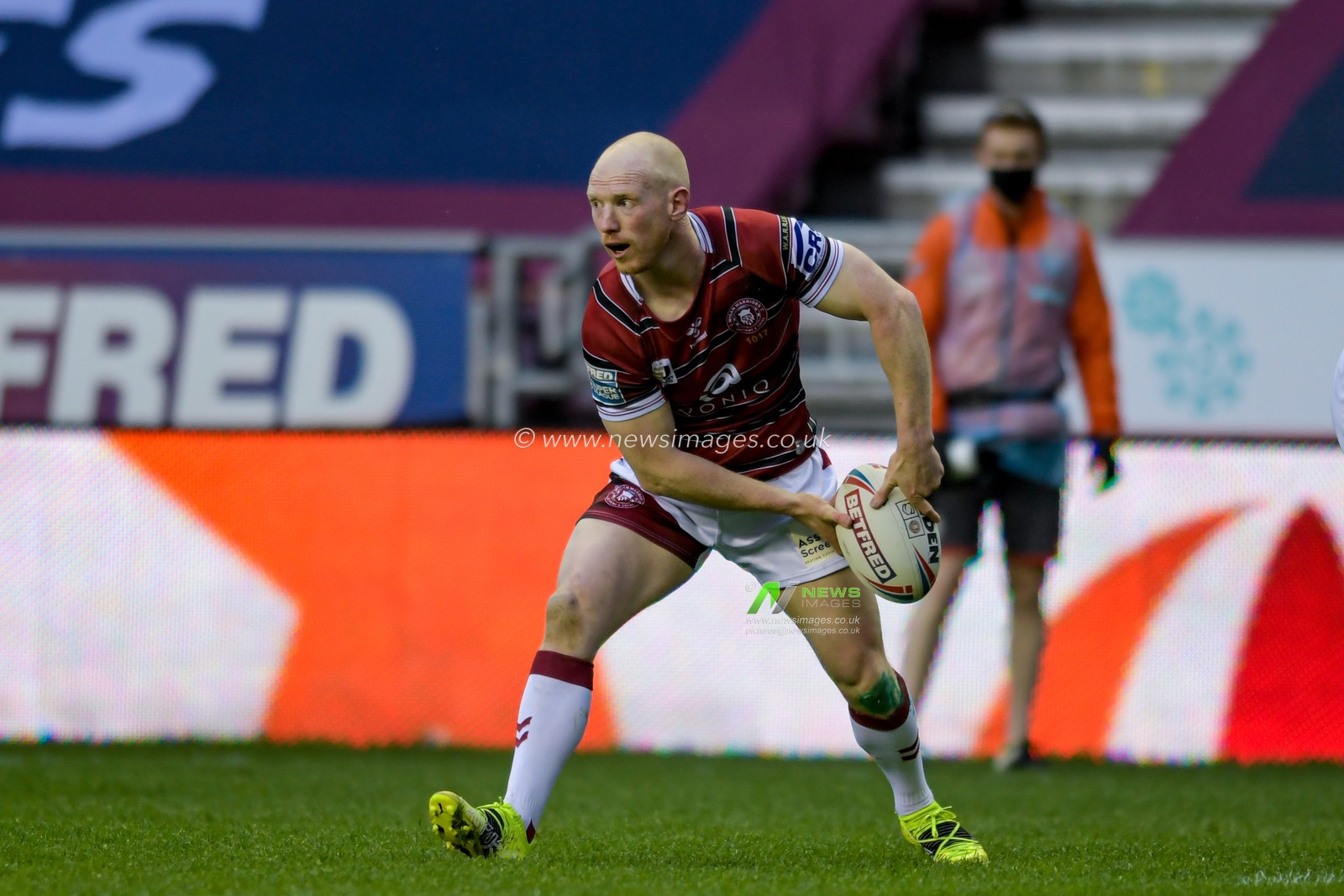 Liam Farrell (12) of Wigan Warriors looks for a pass