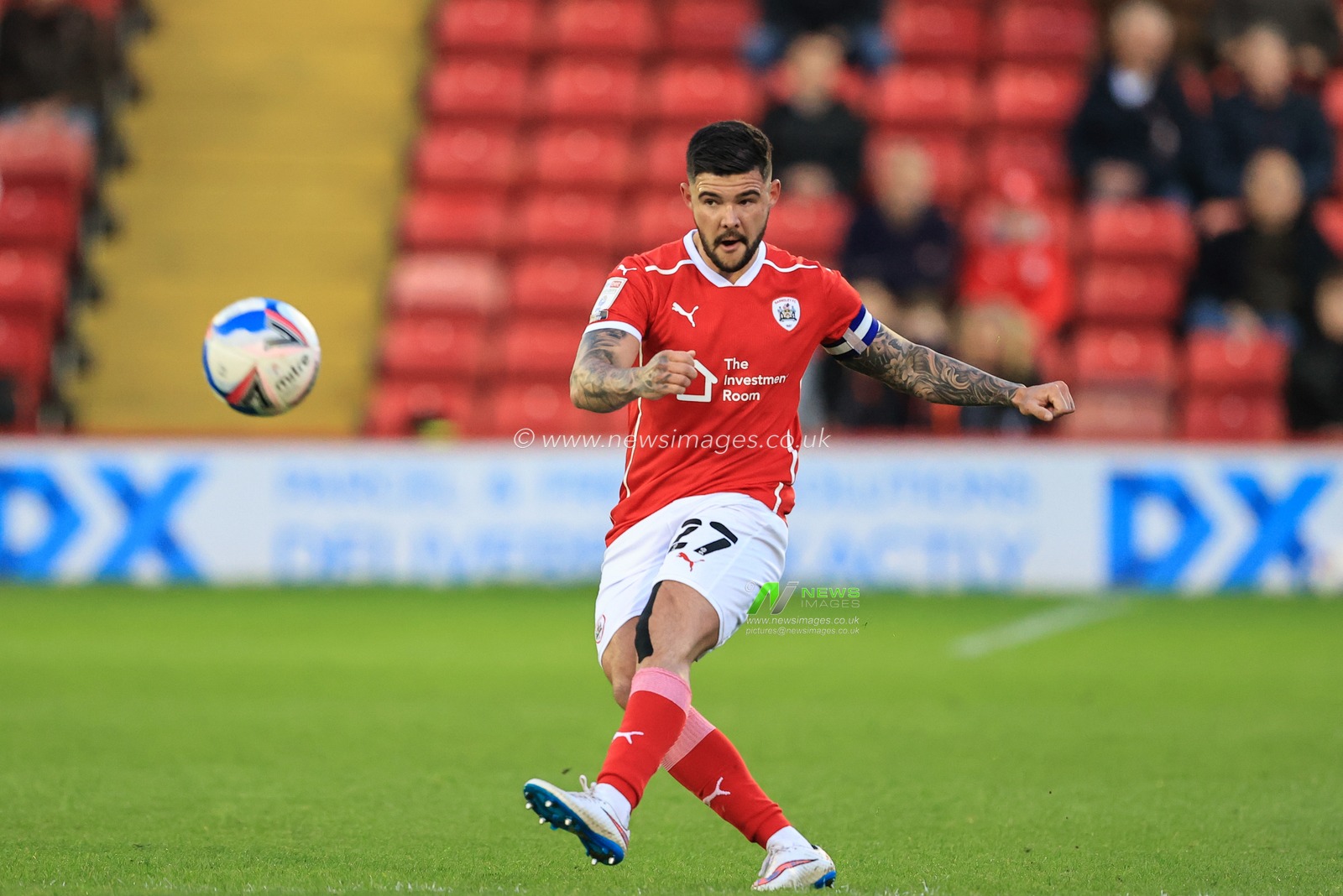 Alex Mowatt #27 of Barnsley takes a free-kick