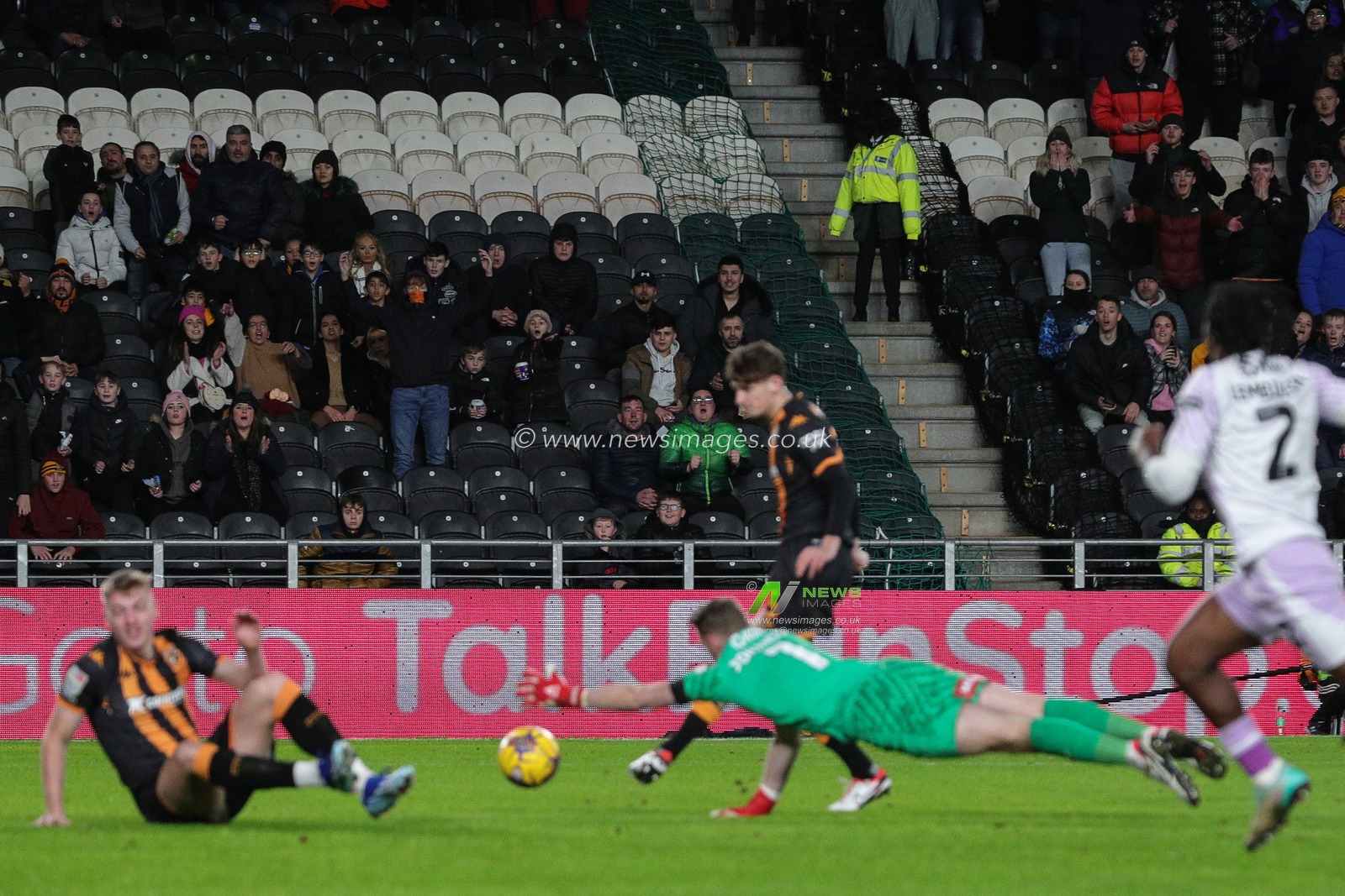 Hull City supporters look on as Tyler Morton #15 of Hull City  scores a goal and makes it 1-0 during the Sky Bet Championship match Hull City vs Rotherham United at MKM Stadium, Hull, United Kingdom, 28th November 2023

(Photo by James Heaton/News Images)