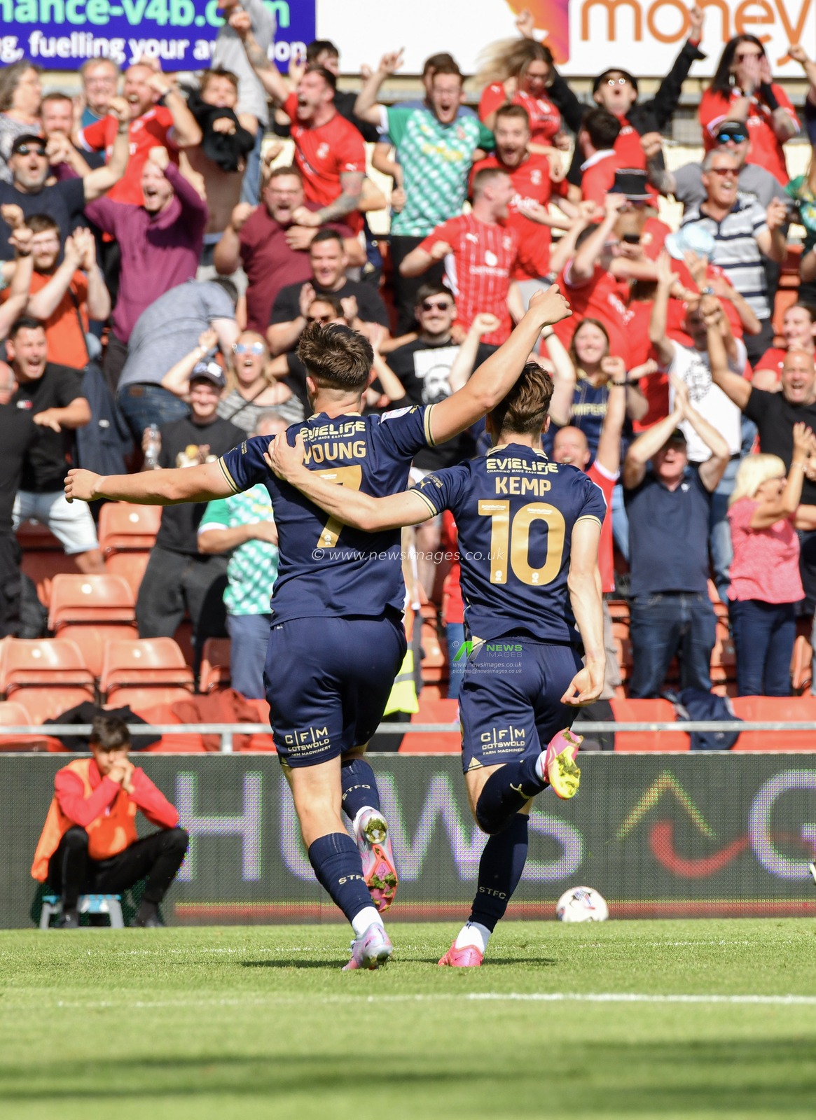 Swindon's Jake Young and Swindon's Dan Kemp celebrates Swindon's Jake Young goal, during the Sky Bet League 2 match Wrexham vs Swindon Town at The Racecourse Ground, Wrexham, United Kingdom, 19th August 2023

(Photo by Cody Froggatt/News Images)