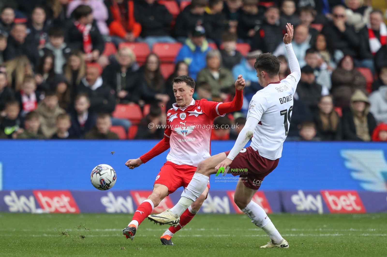 MaÃ«l de Gevigney of Barnsley clears the ball pressured by Kieron Bowie of Northampton Town during the Sky Bet League 1 match Barnsley vs Northampton Town at Oakwell, Barnsley, United Kingdom, 27th April 2024

(Photo by Alfie Cosgrove/News Images)