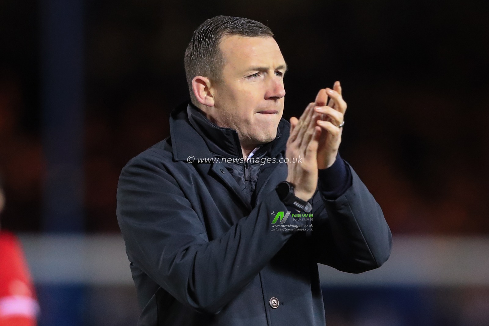 Neill Collins Head coach of Barnsley applauds the travelling fans after a 2-2 draw during the Sky Bet League 1 match Peterborough United vs Barnsley at Weston Homes Stadium, Peterborough, United Kingdom, 29th December 2023

(Photo by Alfie Cosgrove/News Images)