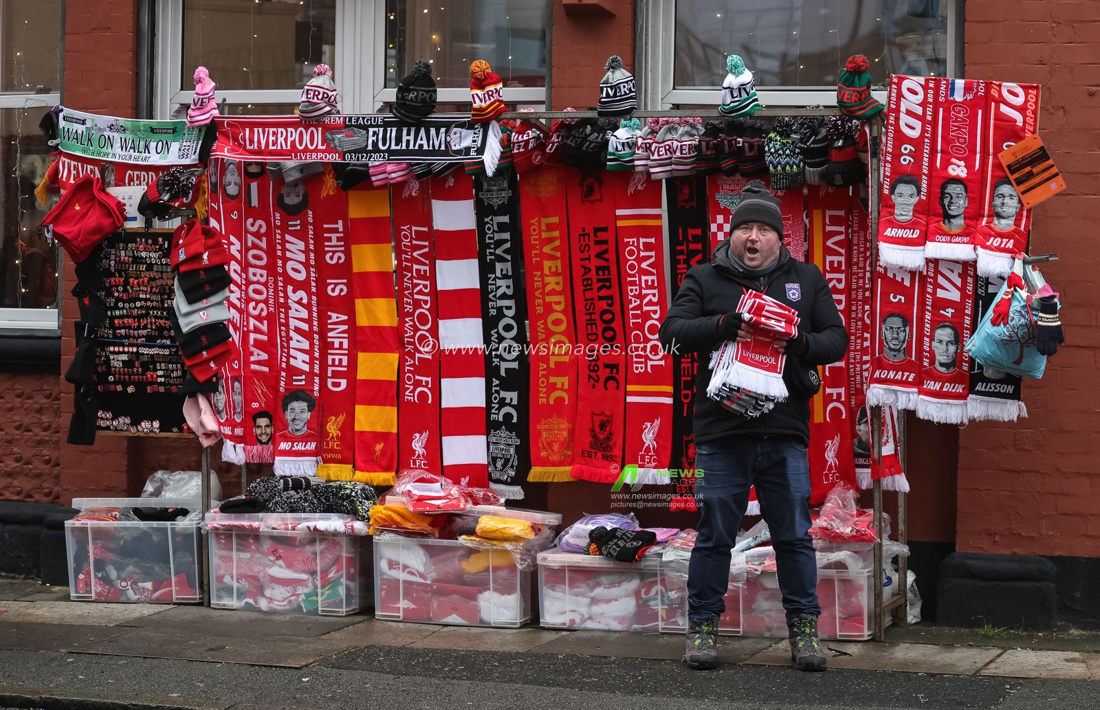 A stall holder selling Liverpool memorabilia during the Premier League match Liverpool vs Fulham at Anfield, Liverpool, United Kingdom, 3rd December 2023

(Photo by Mark Cosgrove/News Images)