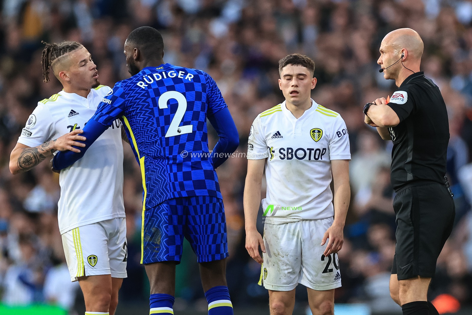 Daniel James #20 of Leeds United is given a straight red card by referee Anthony Taylor