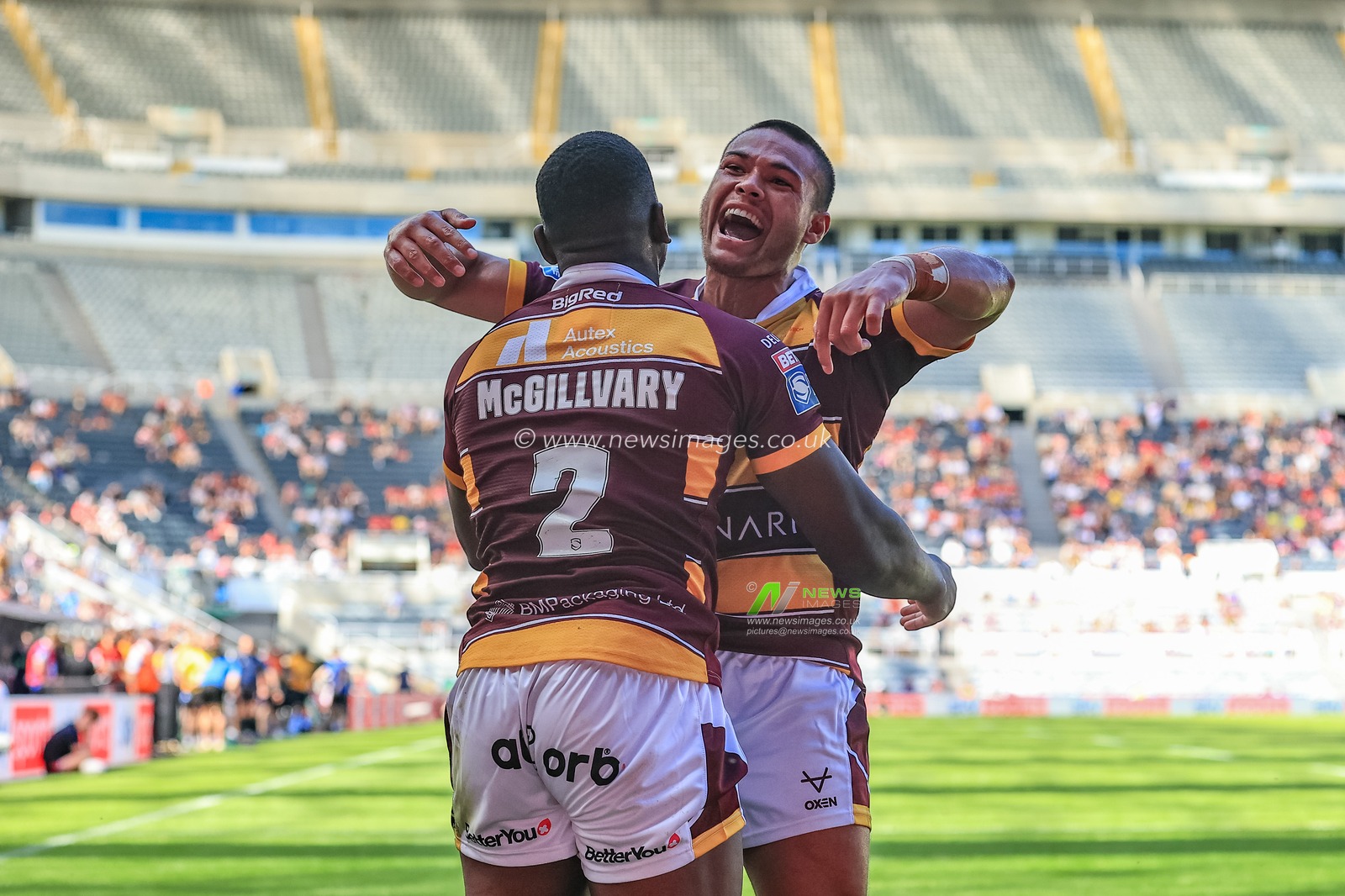 Jermaine McGillvary #2 of Huddersfield Giants celebrates his try with Tui Lolohea #6 of Huddersfield Giants