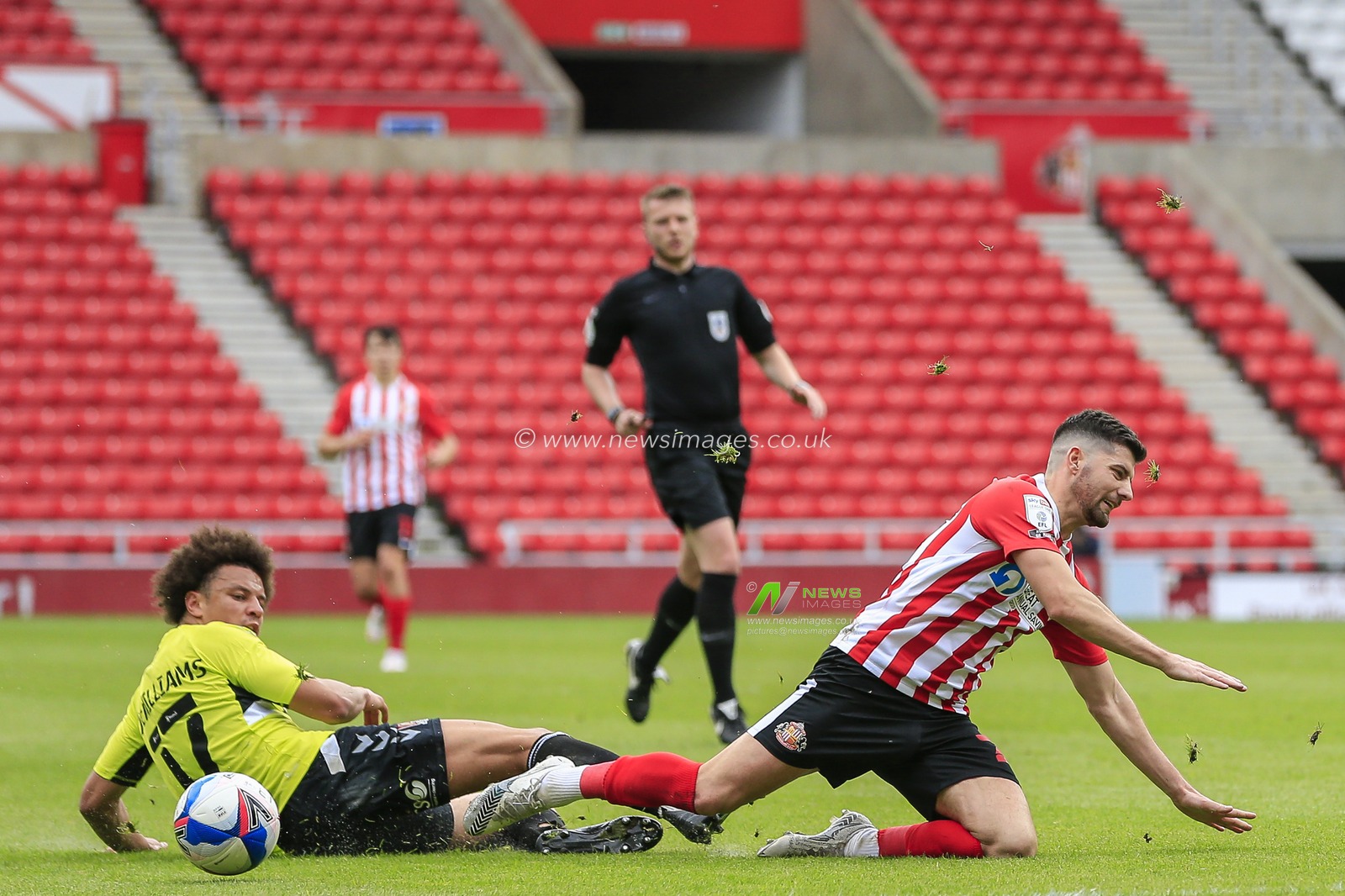 Shaun McWilliams #17 of Northampton Town tackles Jordan Jones #27 of Sunderland