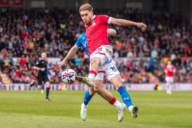 Wrexham's Sam Smith controls the ball during the Sky Bet League 1 match Wrexham vs Stockport County at SToK Cae Ras, Wrexham, United Kingdom, 22nd March 2025

(Photo by Nik Mesney/News Images)