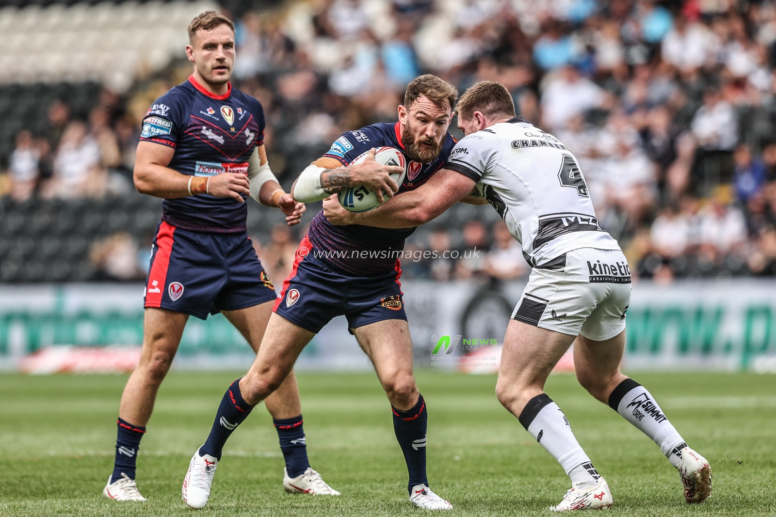Daryl Clark of St. Helens is tackled by Ed Chamberlain of Hull FC during the Betfred Super League round 17 match Hull FC vs St Helens at MKM Stadium, Hull, United Kingdom, 5th July 2025

(Photo by Alfie Cosgrove/News Images)