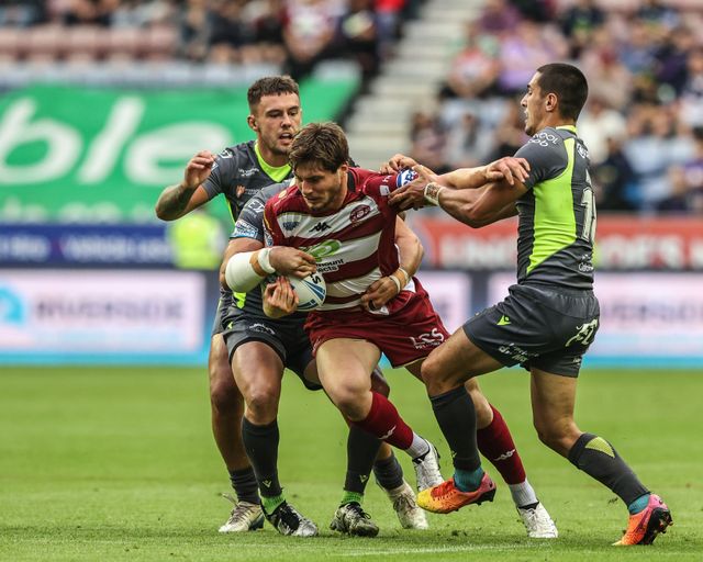 Ethan Havard of Wigan Warriors is tackled by Benjamin Garcia of Catalan Dragons during the Betfred Super League round 20 match Wigan Warriors vs Catalans Dragons at The Brick Community Stadium, Wigan, United Kingdom, 25th July 2025

(Photo by Alfie Cosgrove/News Images)
