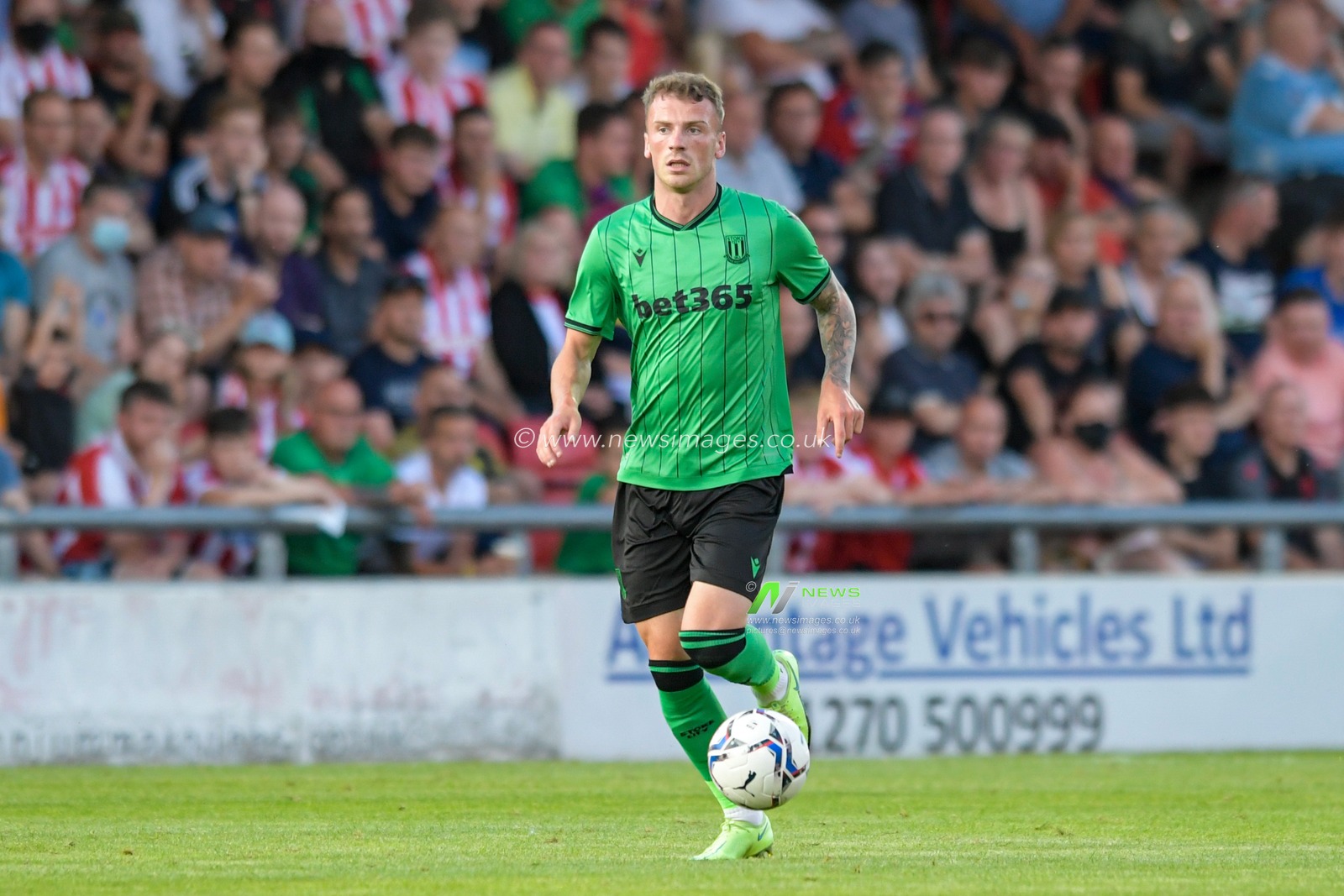 Josh Tymon #14 of Stoke City runs with the ball