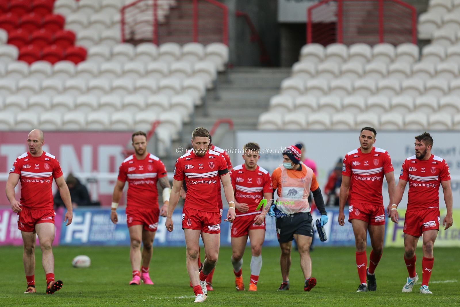 Hull KR players walk back after a try by Shaun Kenny-Dowall (4) of Hull KR
