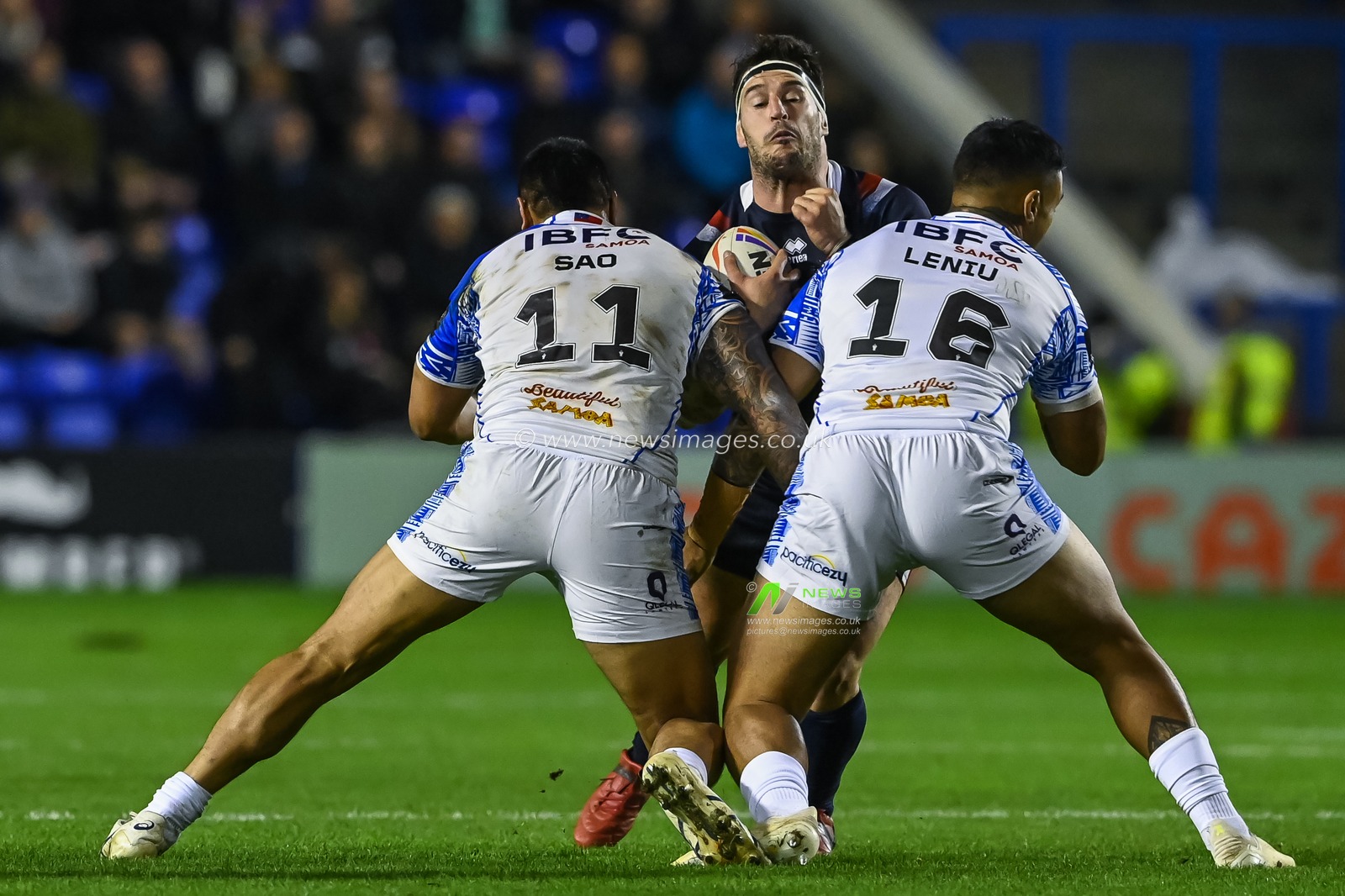 Benjamin Garcia of France is tackled by Ligi Sao and Spencer Leniu of Samoa during the Rugby League World Cup 2021 Group A match Samoa vs France at Halliwell Jones Stadium, Warrington, United Kingdom, 30th October 2022

(Photo by Craig Thomas/News Images)