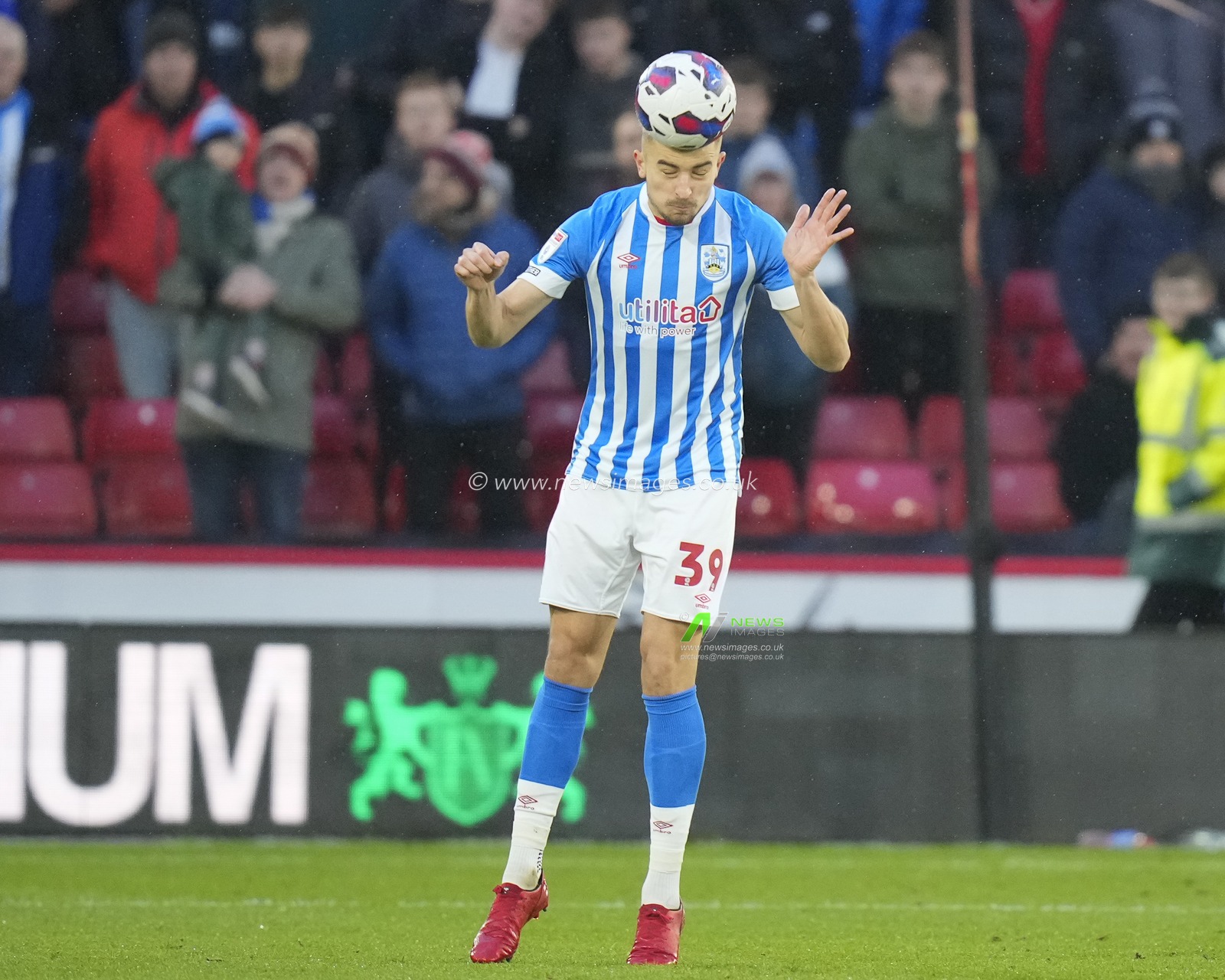 Micha? Helik #39 of Huddersfield Town heads clear during the Sky Bet Championship match Sheffield United vs Huddersfield Town at Bramall Lane, Sheffield, United Kingdom, 10th December 2022

(Photo by Steve Flynn/News Images)