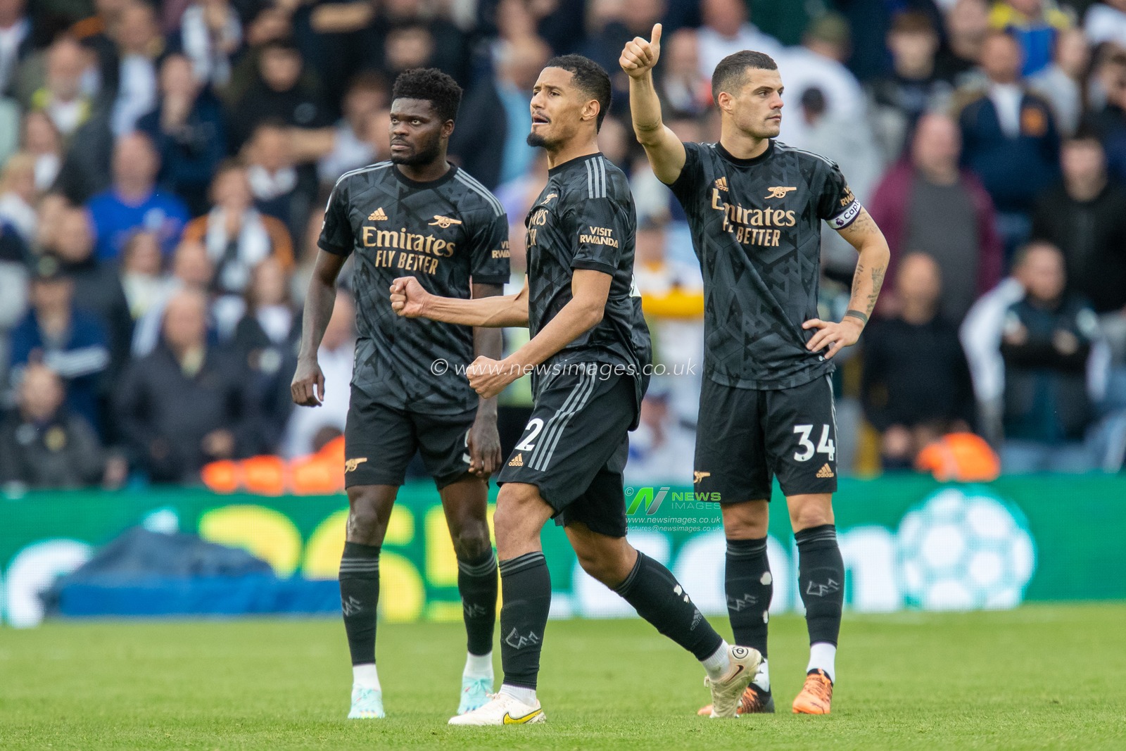 William Saliba #12, Granit Xhaka #34 and Thomas Partey #5 of Arsenal celebrate as the late appeal for a penalty is ruled out by VAR in the second half of the Premier League match Leeds United vs Arsenal at Elland Road, Leeds, United Kingdom, 16th October 2022

(Photo by James Heaton/News Images)