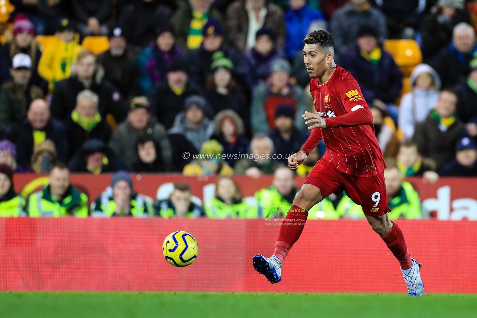 15th February 2020, Carrow Road, Norwich, England; Premier League, Norwich City v Liverpool : Roberto Firmino (9) of Liverpool plays the ball