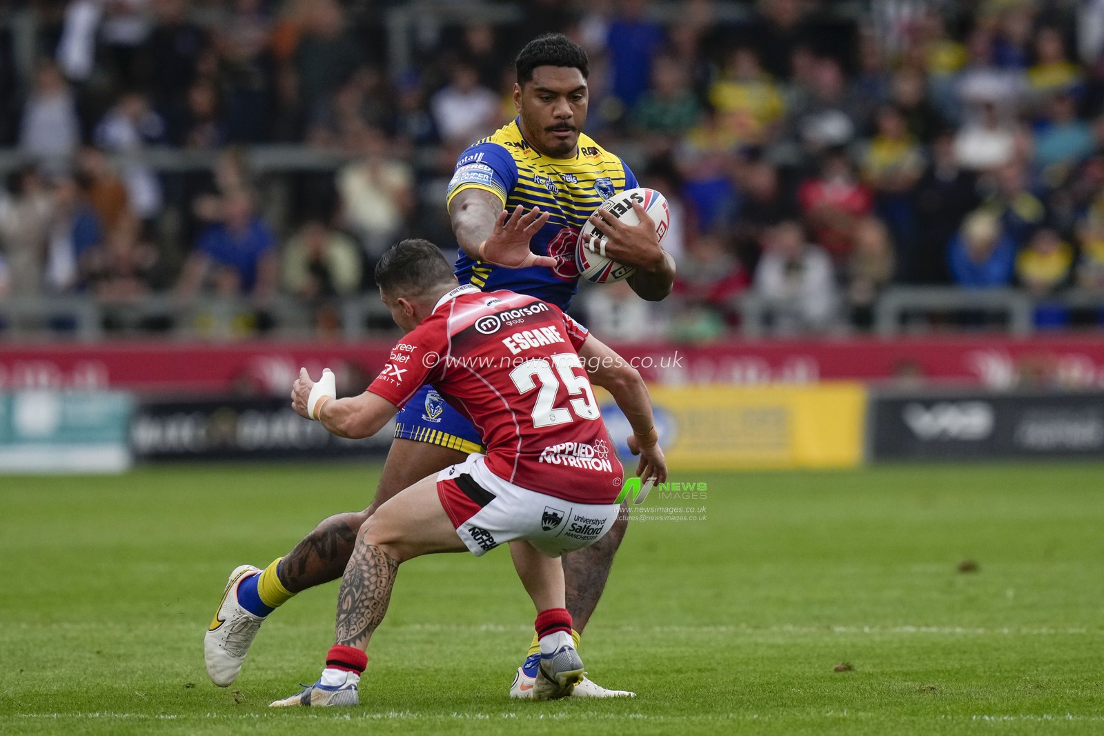 Tom Mikaele #33 of Warrington Wolves runs at Morgan Escare #25 of Salford Red Devils during the Betfred Super League match Salford Red Devils vs Warrington Wolves at AJ Bell Stadium, Eccles, United Kingdom, 3rd September 2022

(Photo by Steve Flynn/News Images)