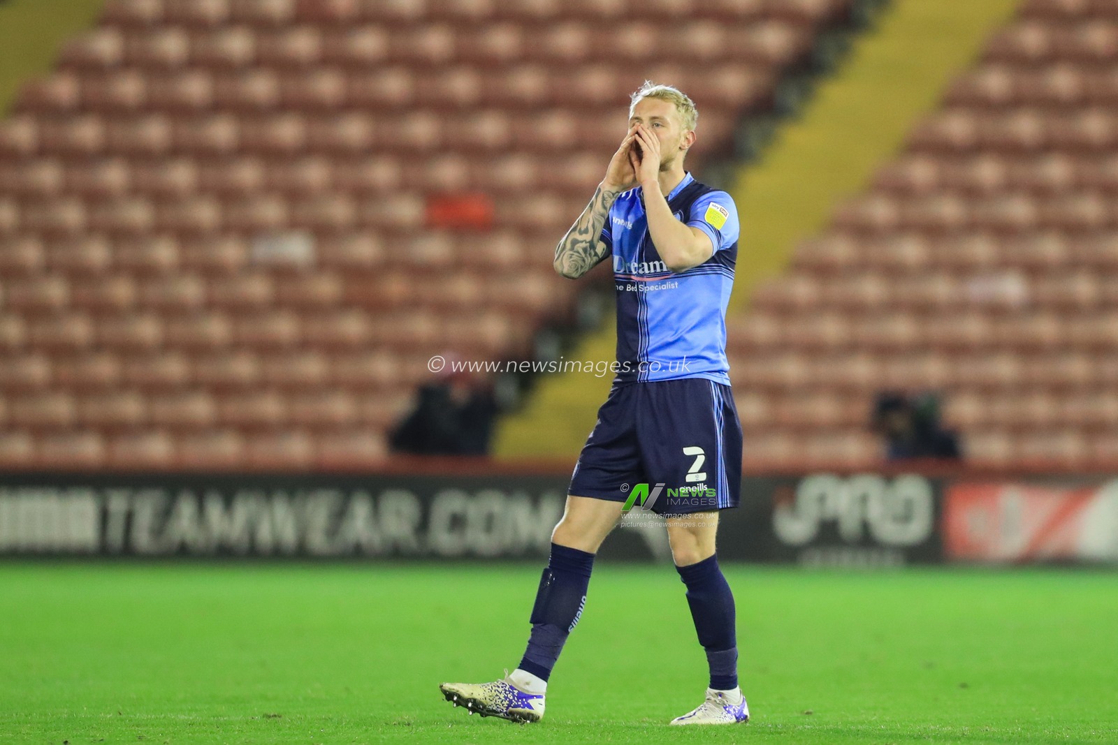 Jack Grimmer #2 of Wycombe Wanderers gives his team instructions during the game