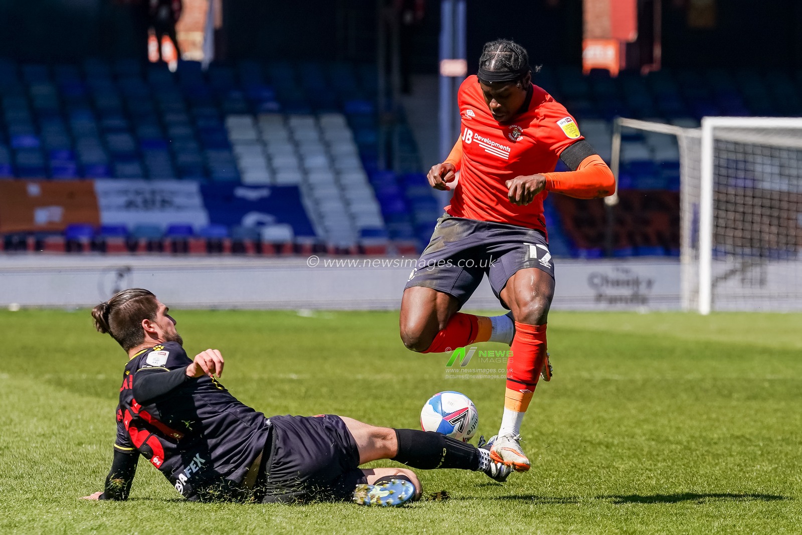 Francisco Sierralta #31 of Watford battles with Pelly Ruddock Mpanzu #17 of Luton Town