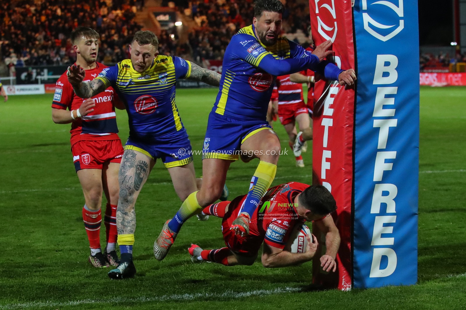 Lachlan Coote #1 of Hull KR goes over for a try
