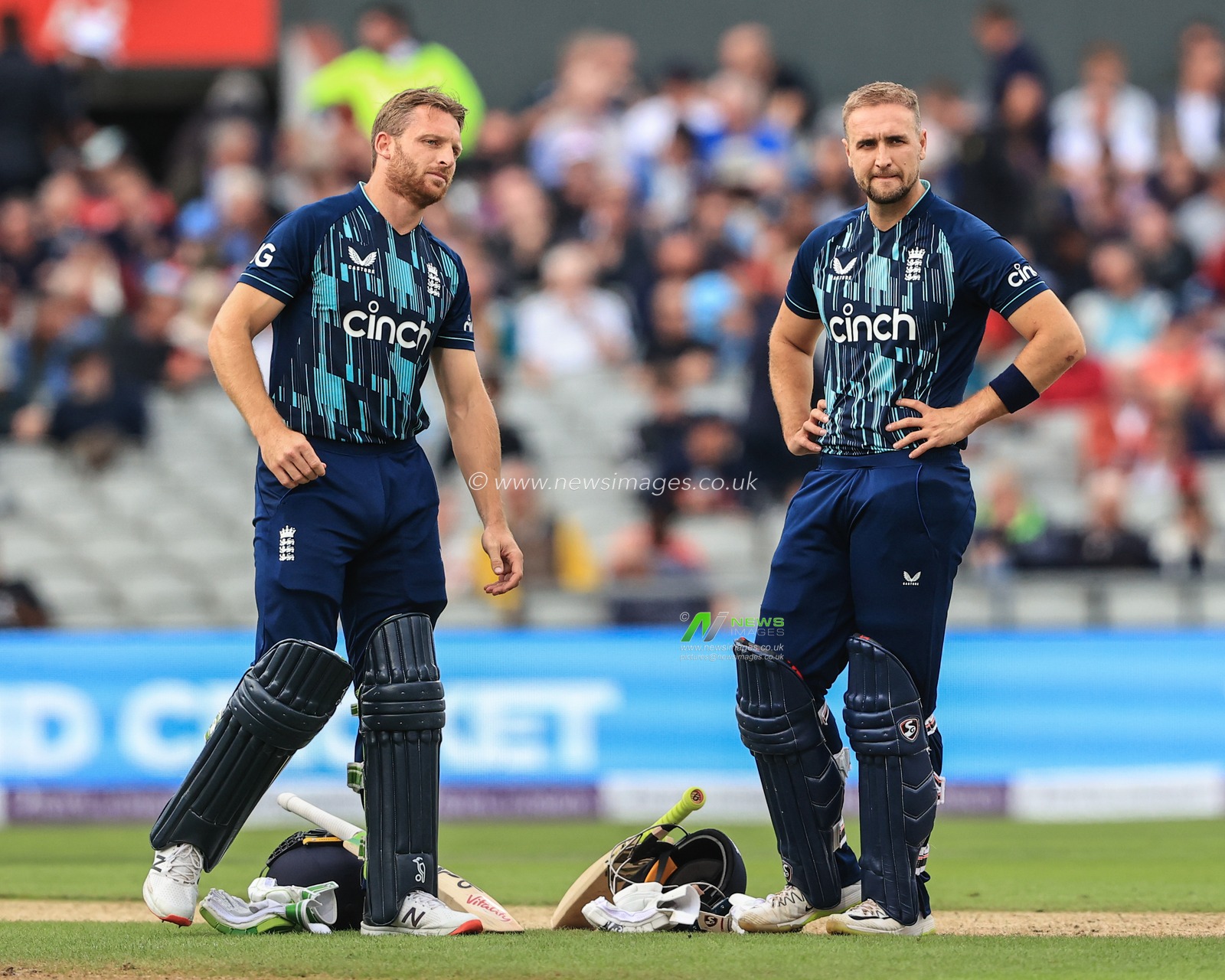 Jos Buttler of England (L) and Liam Livingstone of England (R) during the stop in play for drinks