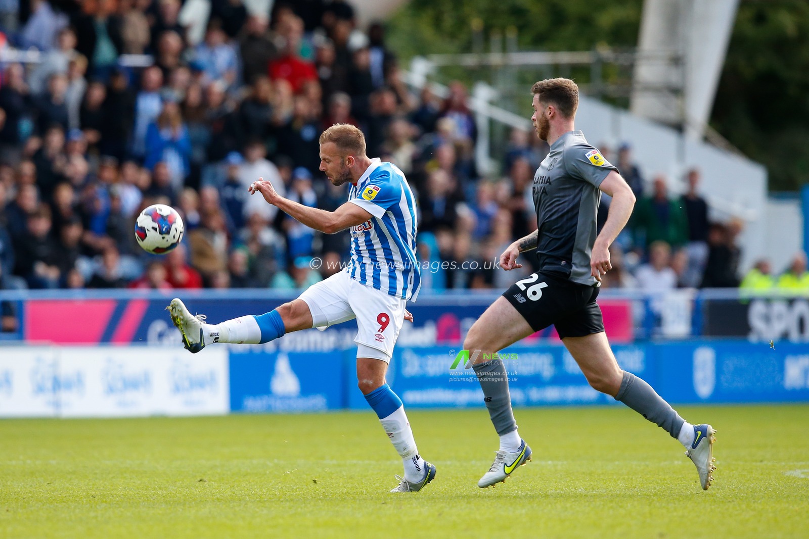Jordan Rhodes #9 of Huddersfield Town attempts a shot on goal from near the half way line during the Sky Bet Championship match Huddersfield Town vs Cardiff City at John Smith's Stadium, Huddersfield, United Kingdom, 17th September 2022

(Photo by Ben Early/News Images)