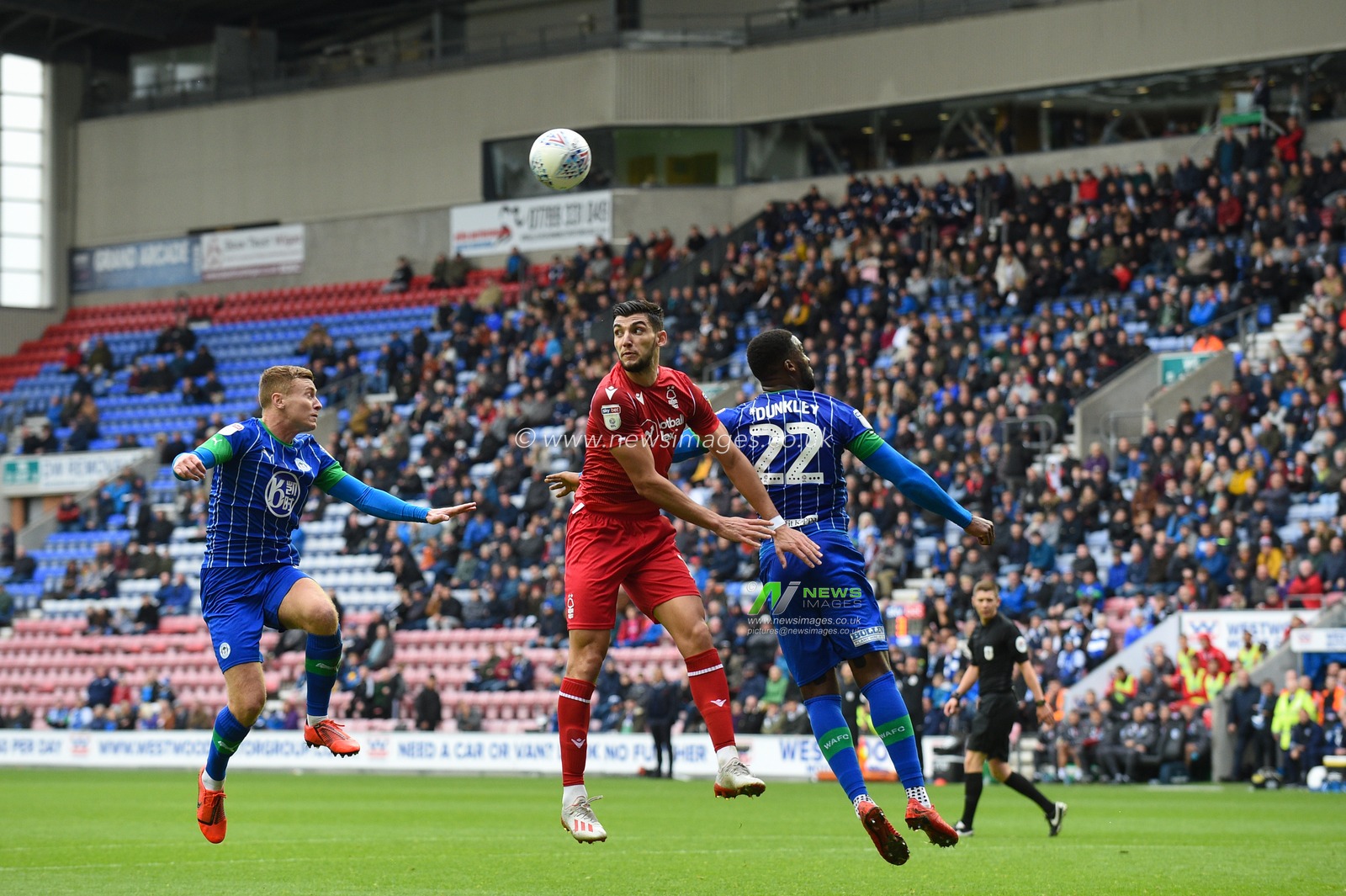 20th October 2019, DW Stadium, Wigan, England; Sky Bet Championship, Wigan Athletic v Nottingham Forest : Rafa Mir (14) of Nottingham Forest and Cheyenne Dunkley (22) of Wigan Athletic challenge for the high ball

Credit: Richard Long/News Images