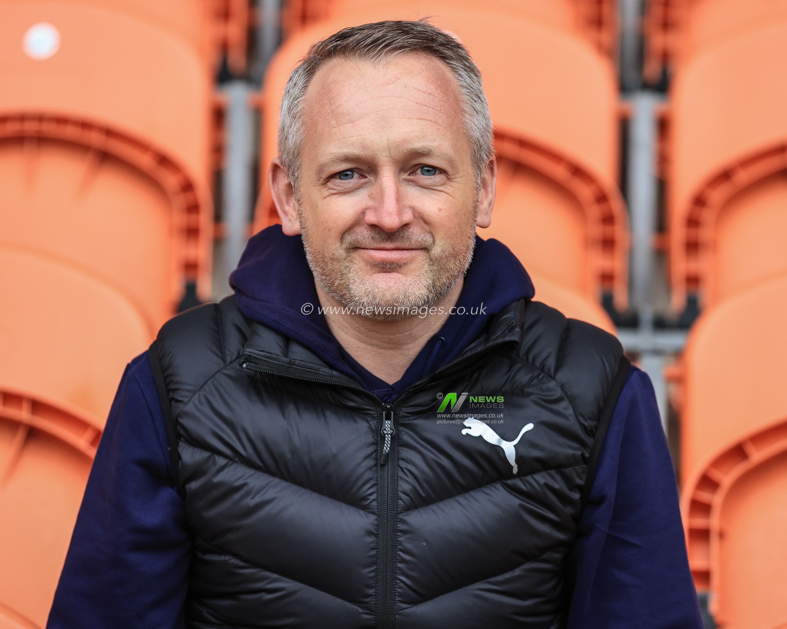 Neil Critchley head coach of Blackpool sits in the tangerine seats of Bloomfield Road