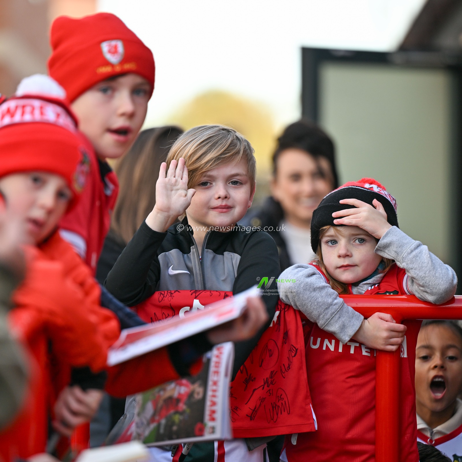 A young Wrexham fan waves at Luke Young 8# of Wrexham Association Football Club as he arrives ahead of the match, during the Sky Bet League 2 match Wrexham vs Gillingham at SToK Cae Ras, Wrexham, United Kingdom, 11th November 2023

(Photo by Cody Froggatt/News Images)