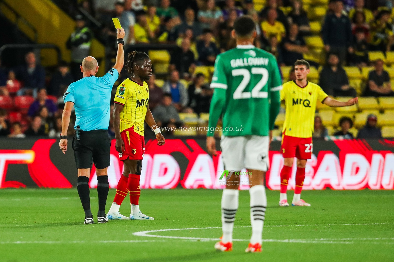 Andy Davies shows a yellow card to Tom Dele-Bashiru of Watford during the Carabao Cup match Watford vs Plymouth Argyle at Vicarage Road, Watford, United Kingdom, 27th August 2024

(Photo by Izzy Poles/News Images)