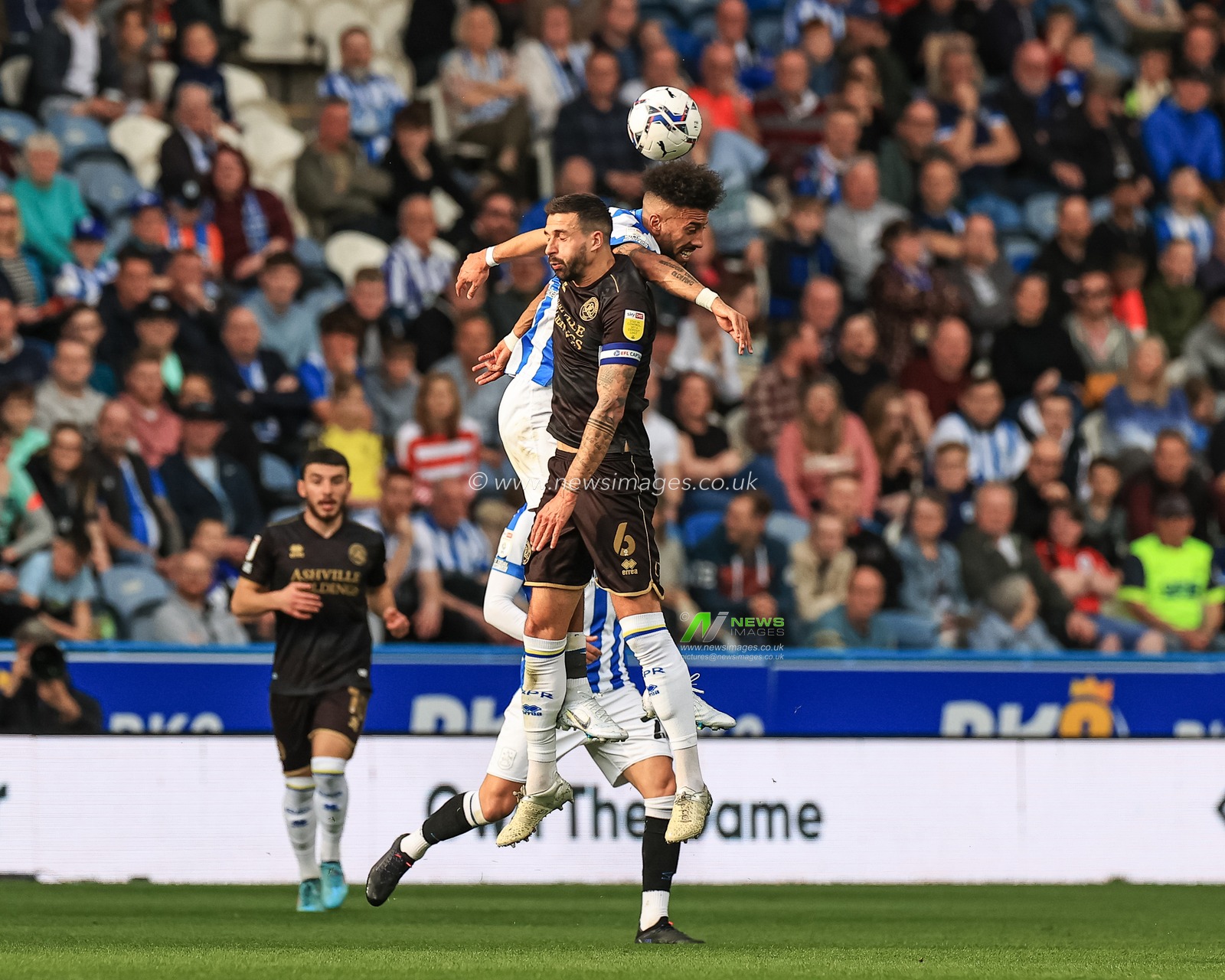 Sorba Thomas #16 of Huddersfield Town and Yoann Barbet #6 of Queens Park Rangers battle for the ball