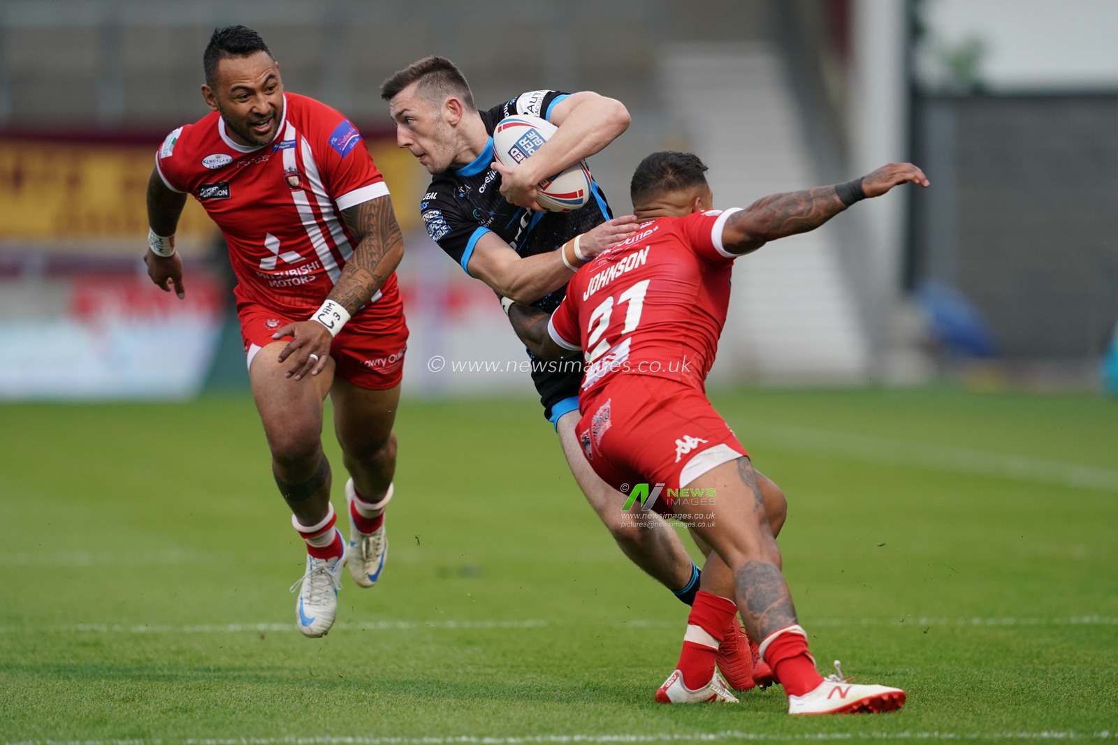 Huddersfield Giants's Jake Wardle is tackled by  Salford Red Devils's Greg Johnson


4th July 2019 ,  AJ Bell Stadium, Salford, England;  Betfred Super League, Round 21, Salford Red Devils vs Huddersfield Giants ; 

Credit: Terry Donnelly/News Images