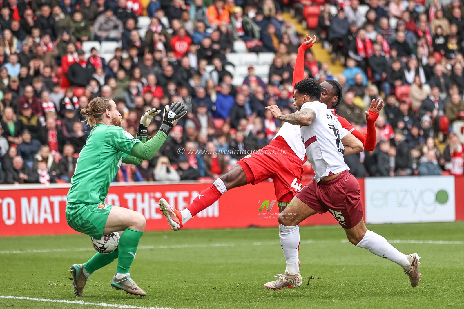 Lee Burge of Northampton Town stops a shot from Devante Cole of Barnsley during the Sky Bet League 1 match Barnsley vs Northampton Town at Oakwell, Barnsley, United Kingdom, 27th April 2024

(Photo by Mark Cosgrove/News Images)