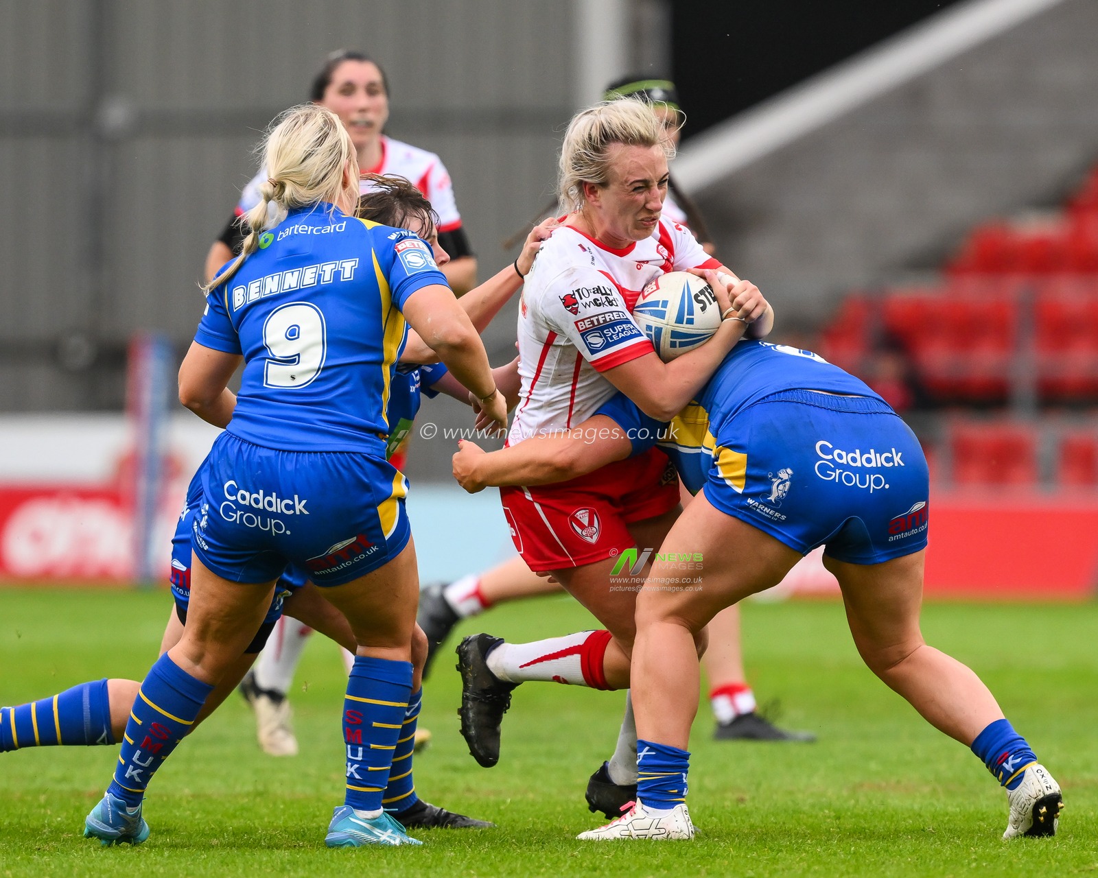 Jodie Cunningham of St Helens is tackled by Zoe Hornby of Leeds Rhinosduring the Betfred Women's Super League match St Helens vs Leeds Rhinos at Totally Wicked Stadium, St Helens, United Kingdom, 24th May 2024

(Photo by Craig Thomas/News Images)