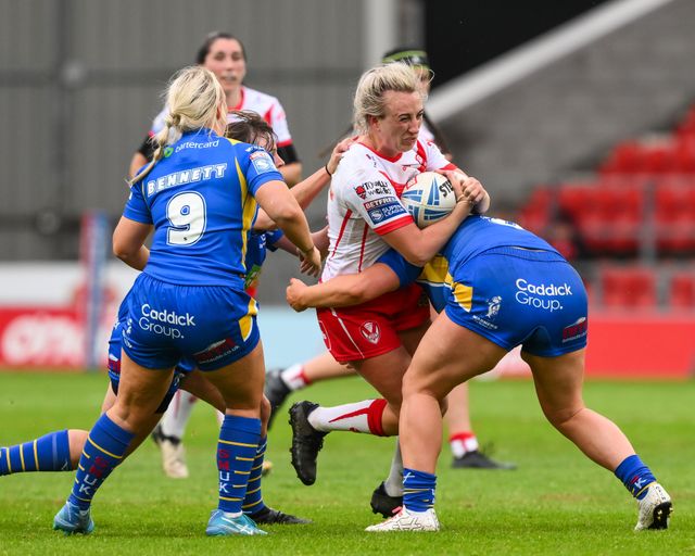 Jodie Cunningham of St Helens is tackled by Zoe Hornby of Leeds Rhinosduring the Betfred Women's Super League match St Helens vs Leeds Rhinos at Totally Wicked Stadium, St Helens, United Kingdom, 24th May 2024

(Photo by Craig Thomas/News Images)
