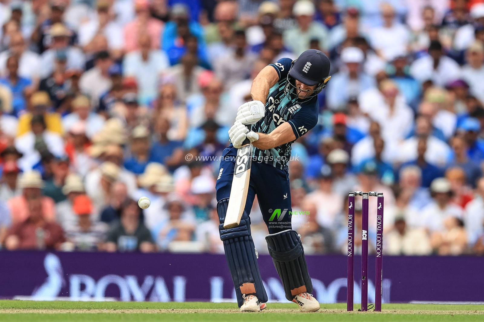 David Willey of England hits a four as England notch up 100 runs