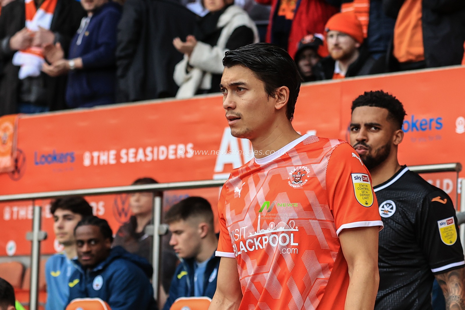Kenny Dougall #12 of Blackpool walks out for kick-off