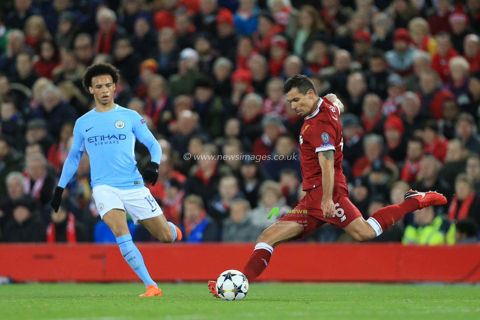 4th April 2018 , Anfield, Liverpool, England; Champions League Quarter Final, first leg, Liverpool v Manchester City; Dejan Lovren of Liverpool passes the ball as Leroy Sane of Manchester City presses