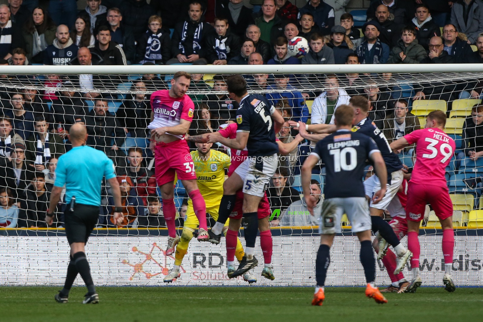 Tom Lees #32 of Huddersfield Town heads clear during the Sky Bet Championship match Millwall vs Huddersfield Town at The Den, London, United Kingdom, 18th March 2023

(Photo by Arron Gent/News Images)