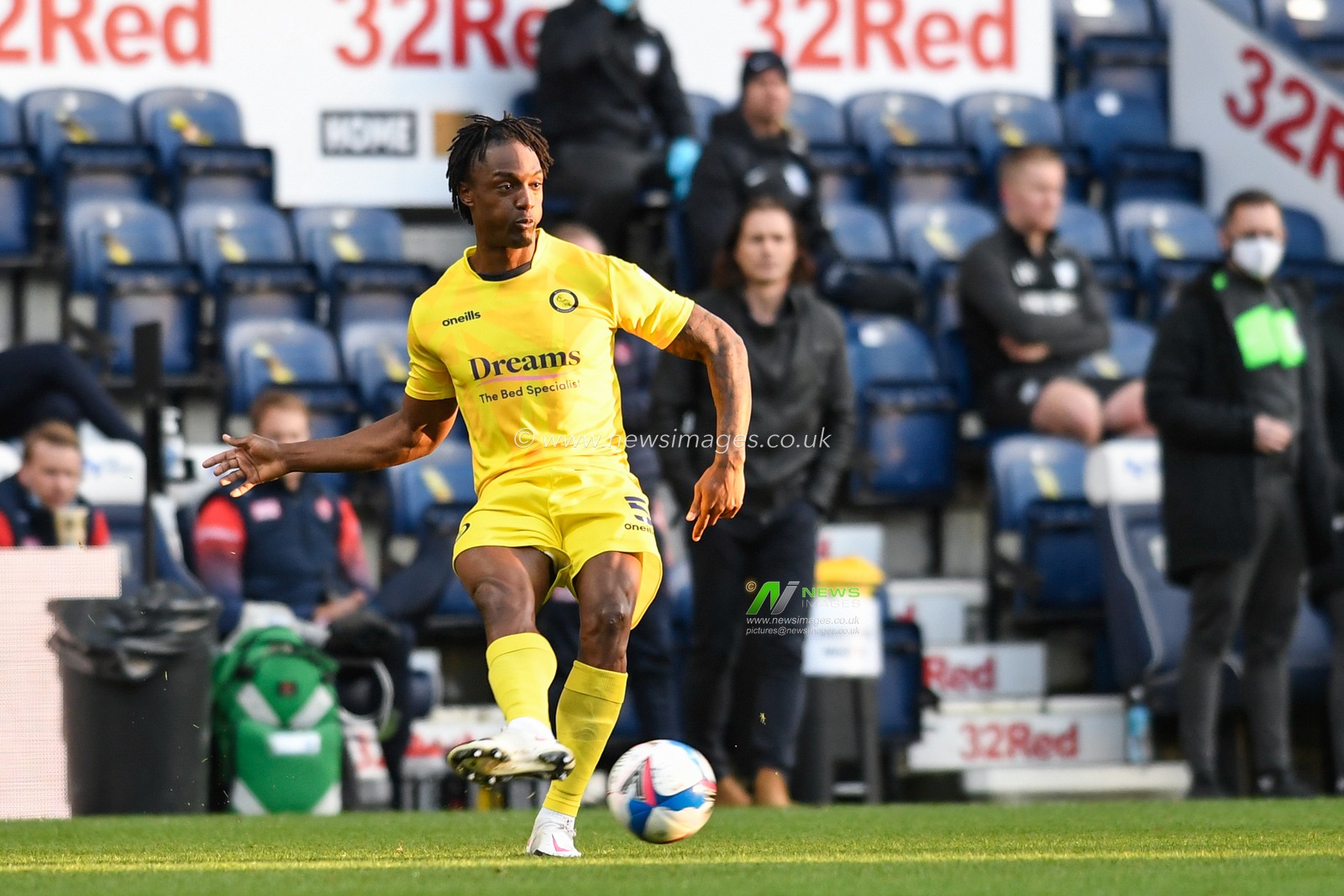 Anthony Stewart #5 of Wycombe Wanderers passes the ball