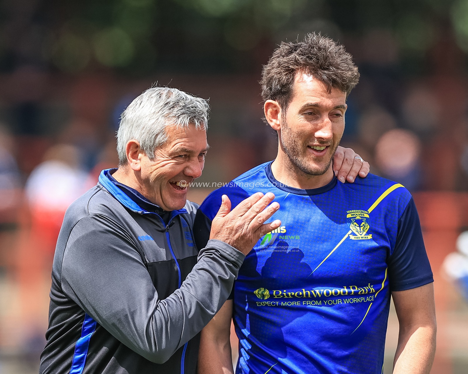 Daryl Powell Head Coach of Warrington Wolves speaks to Stefan Ratchford #1 of Warrington Wolves during pre-game warm up