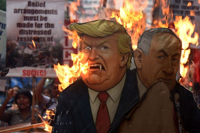 Activists from the Socialist Unity Centre of India (SUCI) burned an effigy of U.S. President Donald Trump and Israeli Prime Minister Benjamin Netanyahu during an anti-Israel protest to express solidarity with Palestinians, in Kolkata on October 7, 2025.Photo by Debajyoti Chakraborty.(Photo: Debajyoti Chakraborty/News Images)