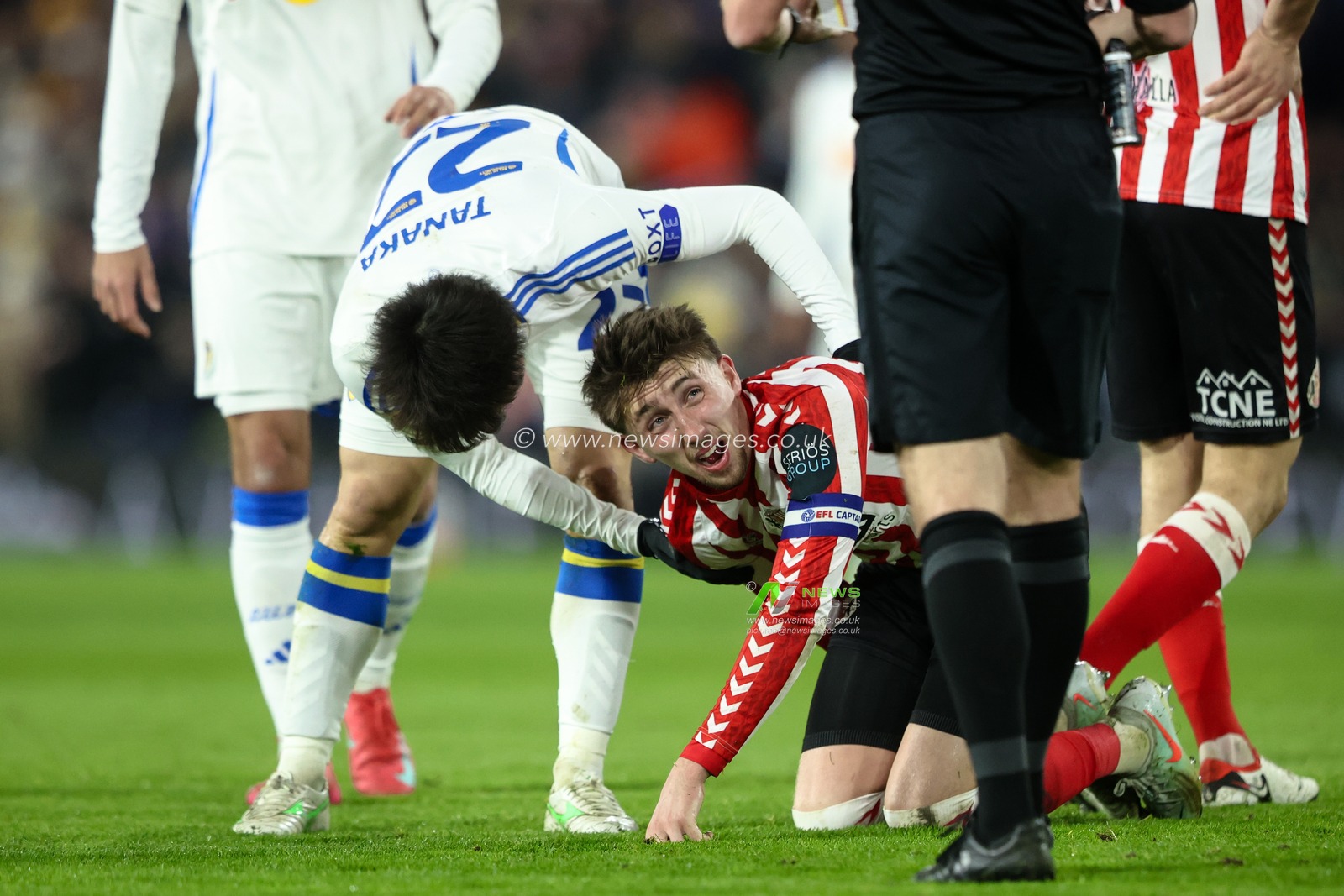 Ao Tanaka of Leeds United checks on Dan Neil of Sunderland after fouling him during the Sky Bet Championship match Leeds United vs Sunderland at Elland Road, Leeds, United Kingdom, 17th February 2025

(Photo by Alfie Cosgrove/News Images)