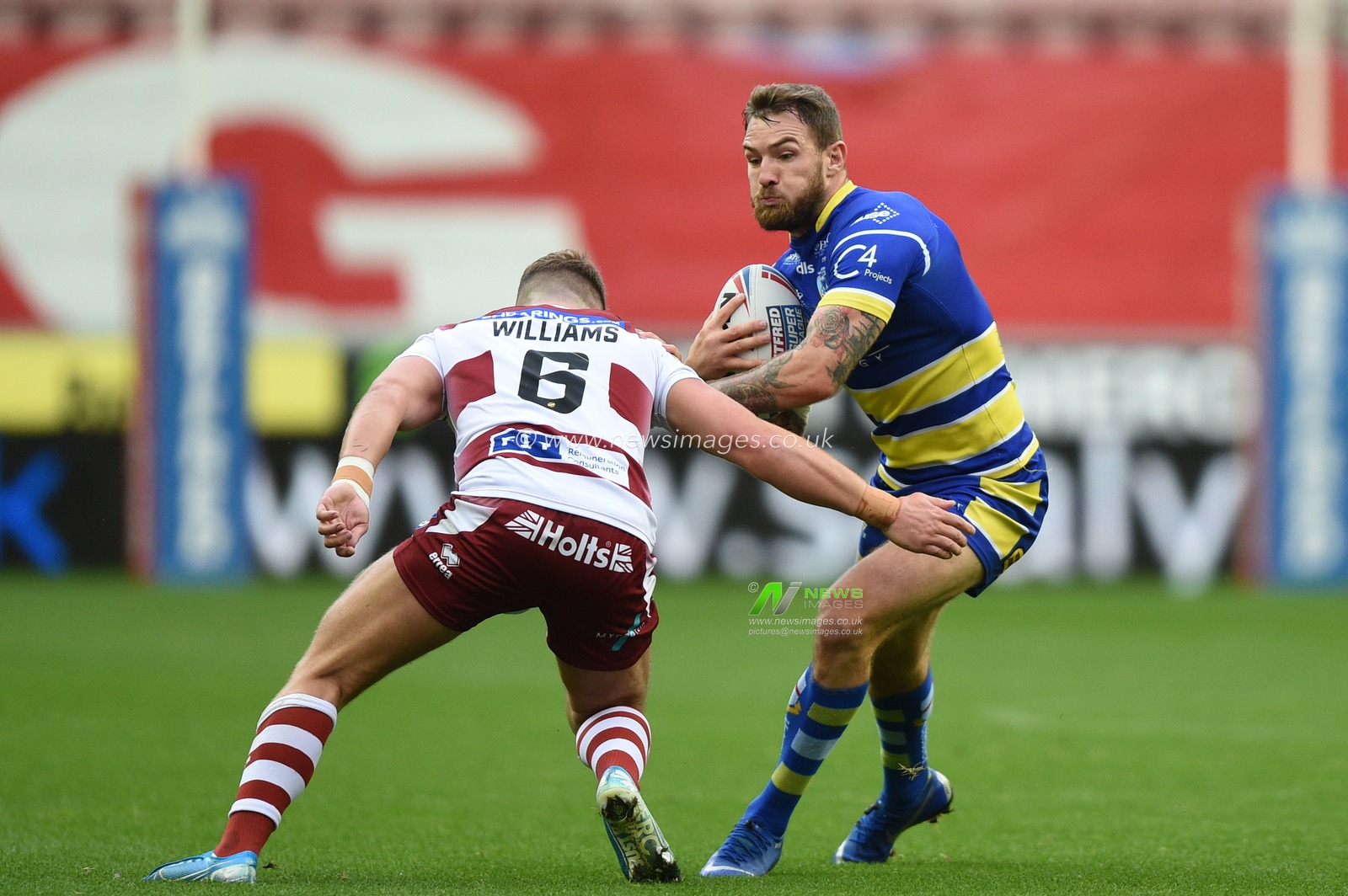 16th August 2019 , DW Stadium, Wigan, England;  Betfred Super League, Round 26, Wigan Warriors vs Warrington Wolves ; Daryl Clark of Warrington Wolves is tackled by George Williams (6) of Wigan Warriors 

Credit: Richard Long/News Images