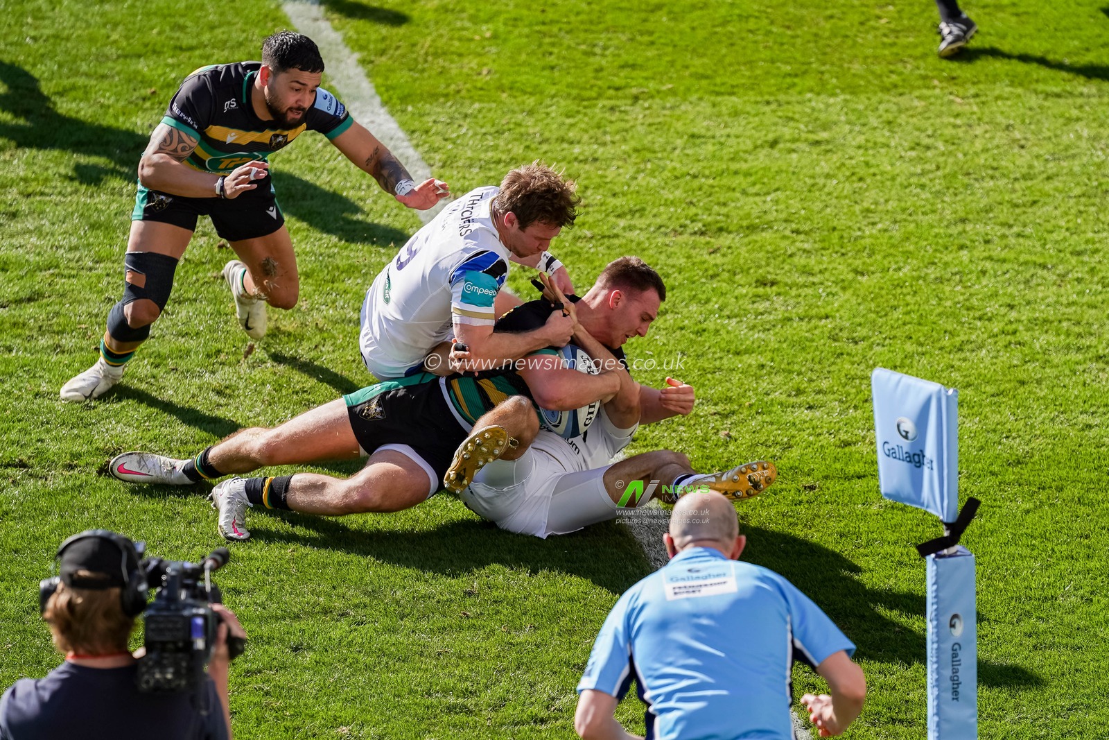 Tom James #9 of Northampton Saints scores the opening try